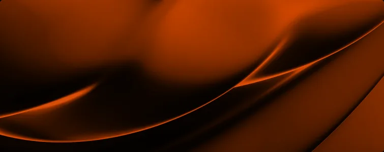 Soft orange light curving through darkness.