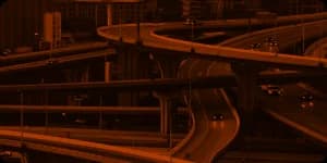A motorway interchange of stacked curving ramps.