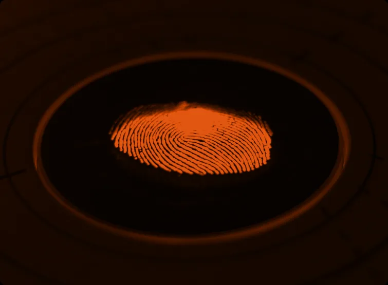 A fingerprint lit inside a dark ring.