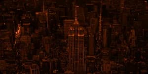 A city skyline at night, lit from within.